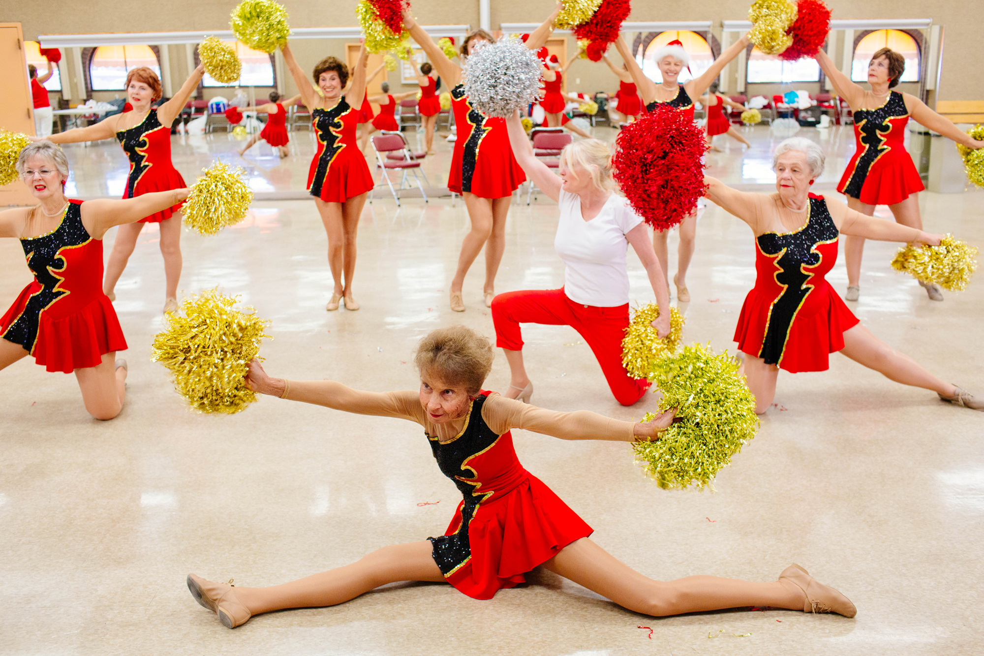 Premium Photo  Cheerleader girls team standing in lines with pompons in  front of them on a court